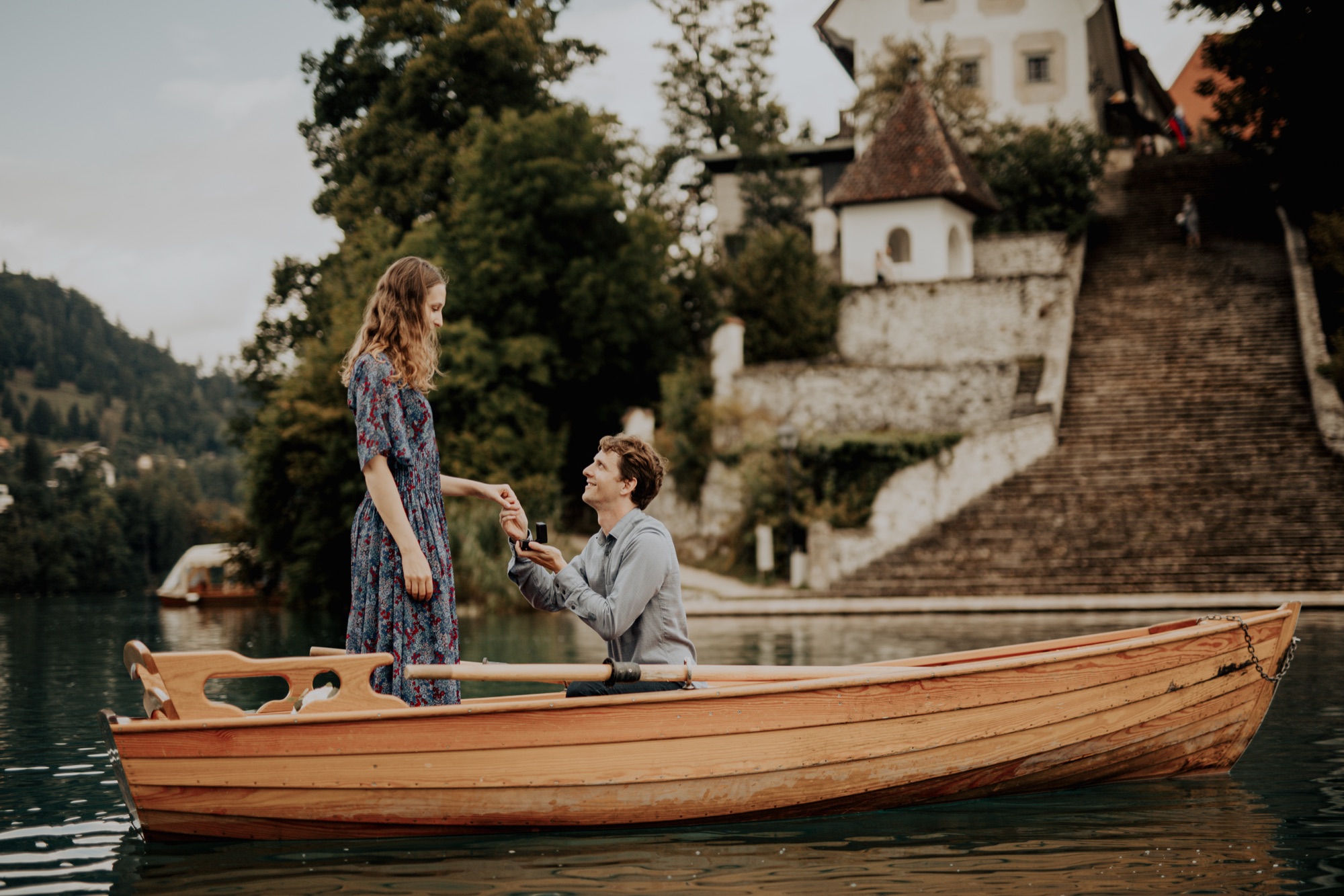Marriage proposal on a wooden boat on Lake Bled