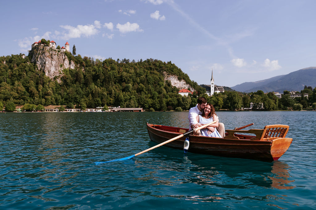 Marriage proposal on a wooden boat on Lake Bled